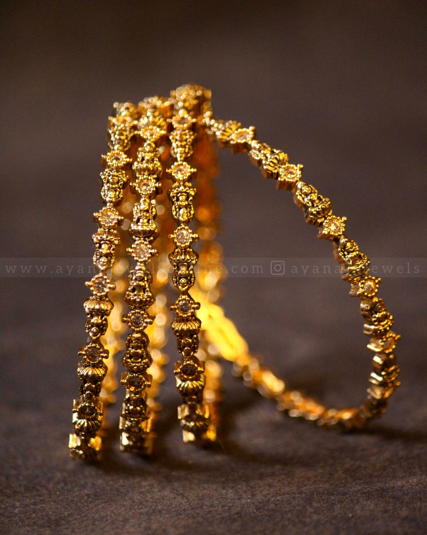 White stone Lakshmi Bangle ( Set of 4 )